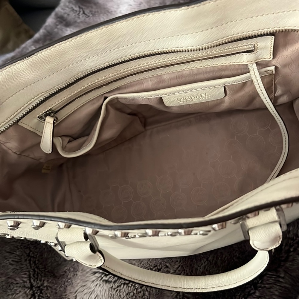 Michael Kors white studded handbag.